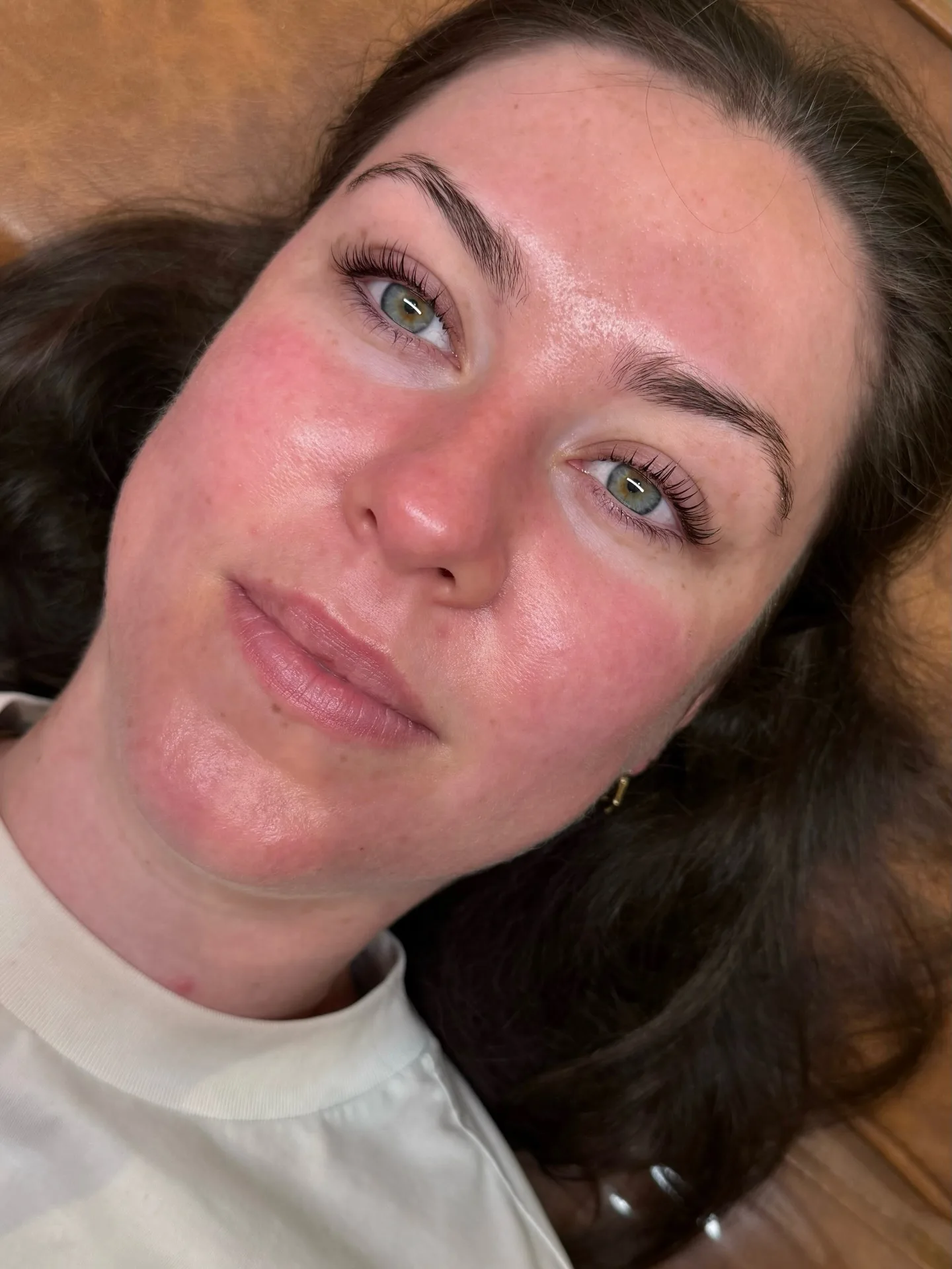 Close-up of soft natural brow result, green eyes, cool daylight