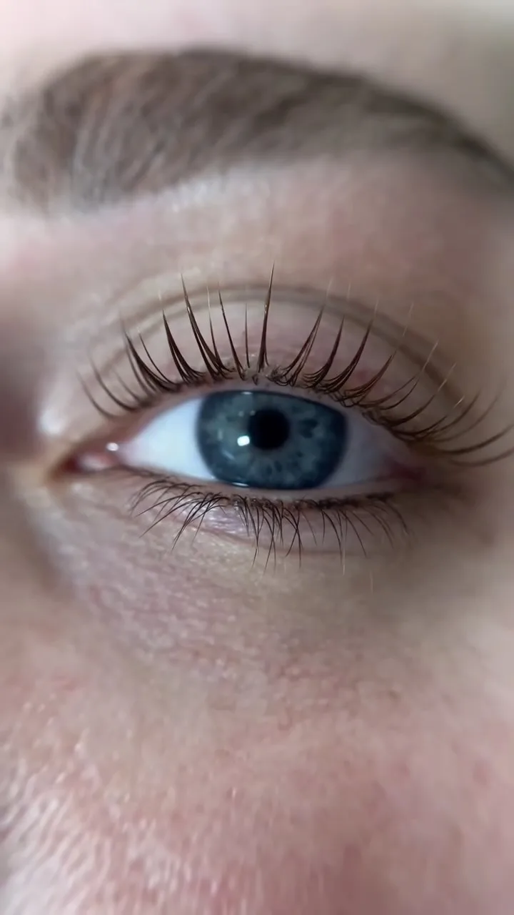 Close-up of a blue eye with root-to-tip Korean lash lift